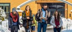 Students walking in winter in front of Dickson Hall